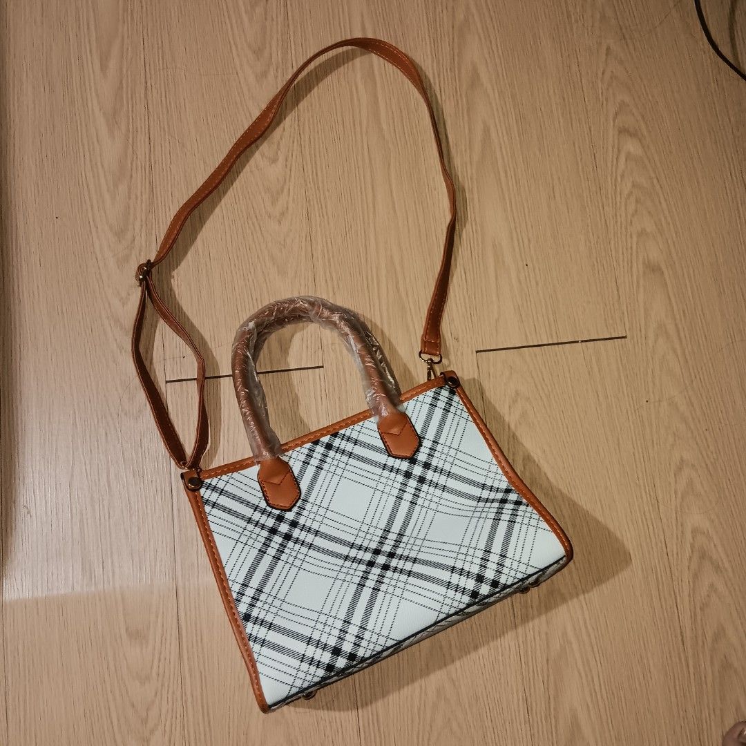 Trendy Plaid Crossbody Bag (Category: Tote Bags) located in Taguig. Submitted by ncomn (Listing ID 1441092247, Image 2). Description: - Plaid tote bag, includes a matching small pouch and detachable straps - Like new and never used .
