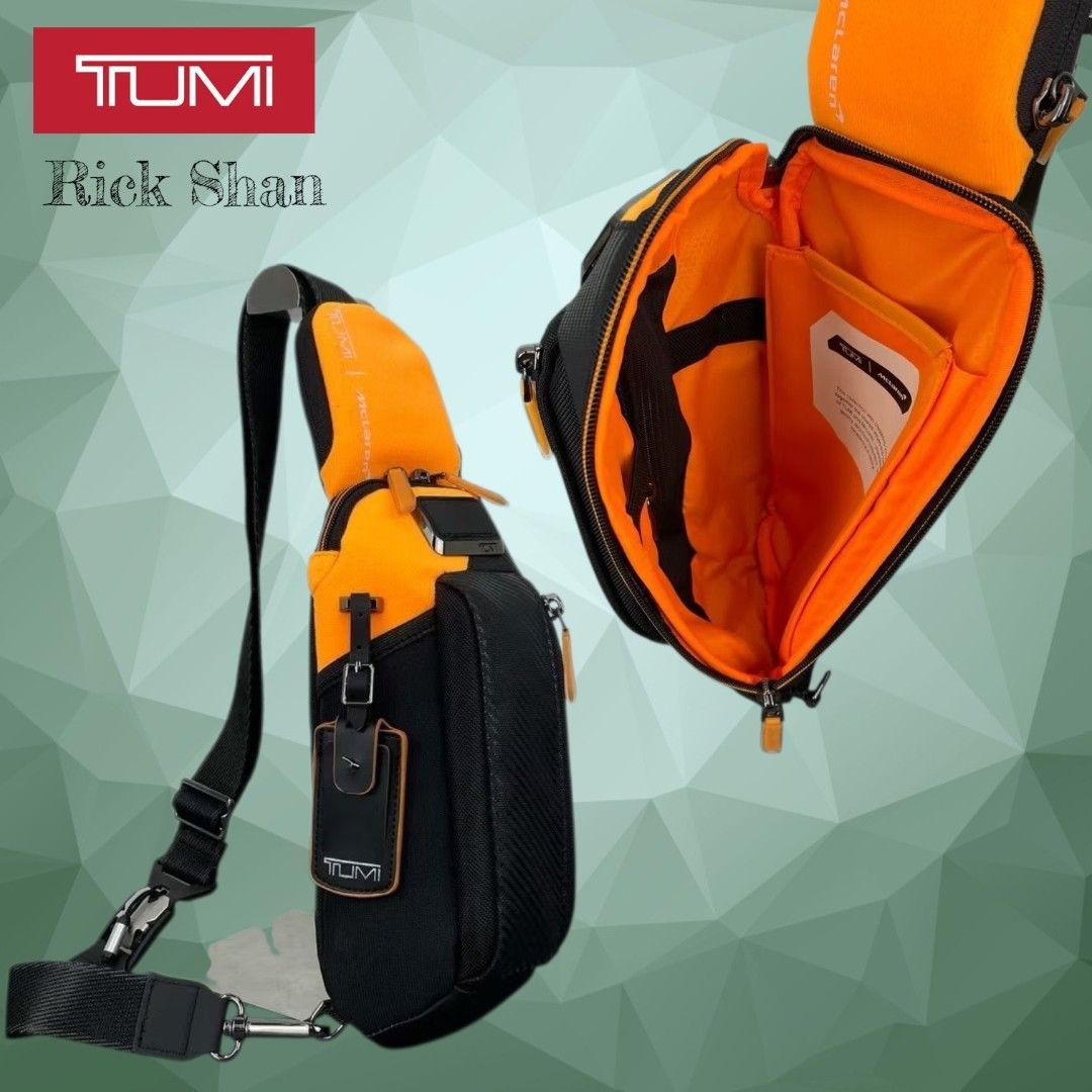 Tumi McLaren Sling Bag Orange Black (Category: Sling Bags) located in Manila. Submitted by r1ckshan (Listing ID 1441007329, Image 2). Description: Tumi McLaren sling bag in black with orange accents. Features a wide-opening main compartment, internal pockets, and an adjustable strap. Perfect for travel or daily use..