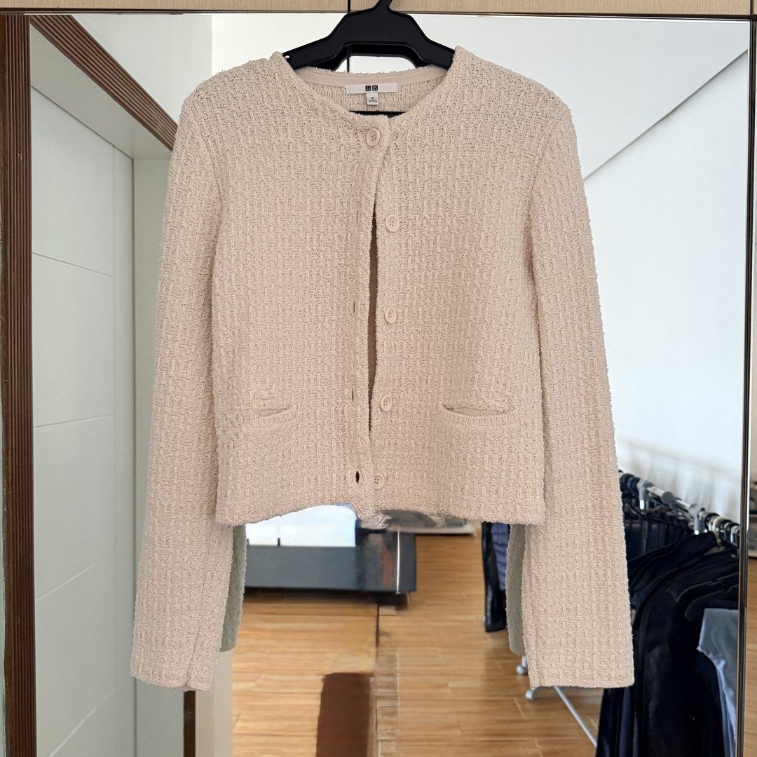 Uniqlo Knit Cardigan (Category: Coats, Jackets and Outerwear) located in Paranaque City. Submitted by shopvillas (Listing ID 1441016068, Image 1). Description: - Uniqlo cream textured knit cardigan - Round neckline - Button-up front - Two small front pockets - Versatile for layering over tops or dresses - Comfortable and stylish for everyday wear.