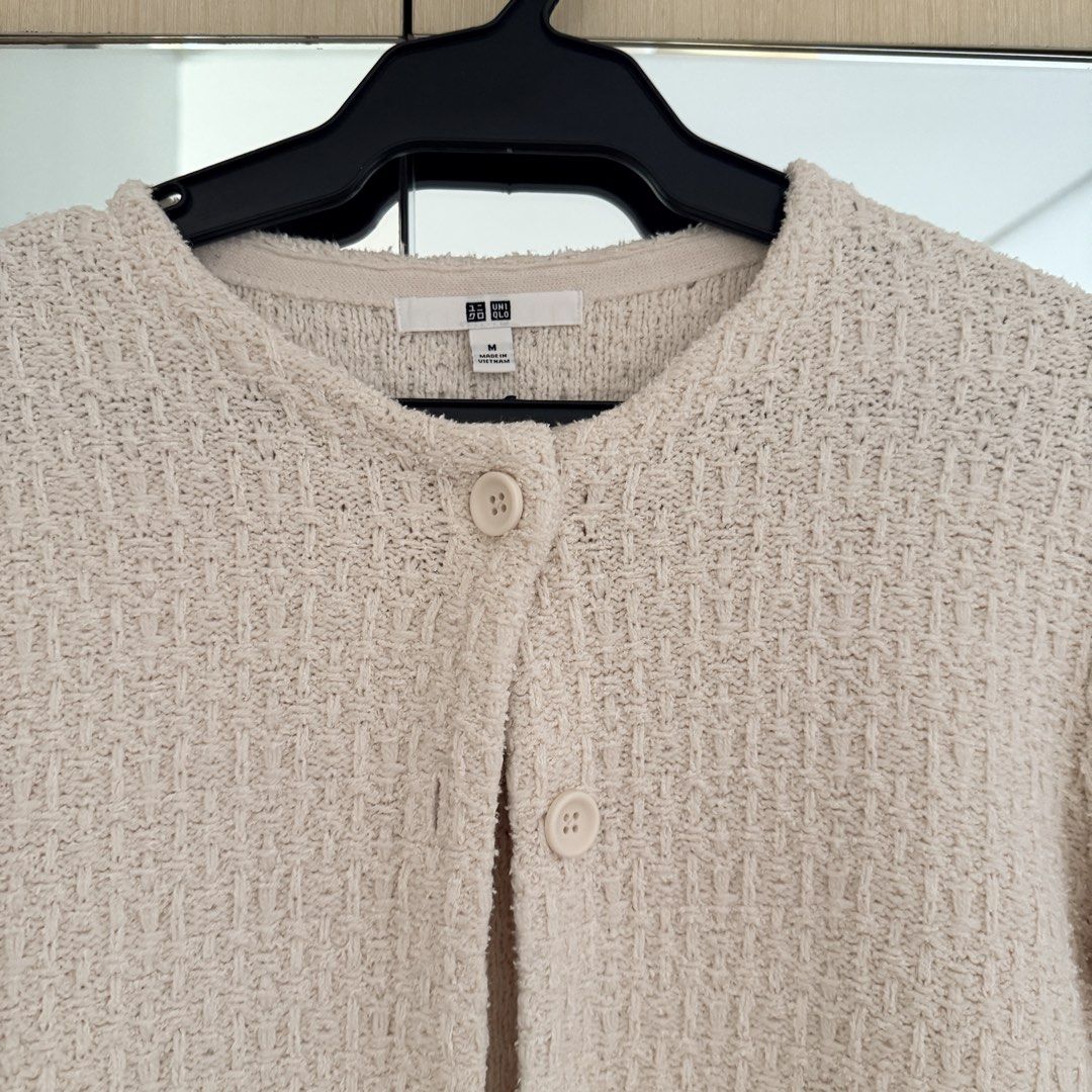 Uniqlo Knit Cardigan (Category: Coats, Jackets and Outerwear) located in Paranaque City. Submitted by shopvillas (Listing ID 1441016068, Image 2). Description: - Uniqlo cream textured knit cardigan - Round neckline - Button-up front - Two small front pockets - Versatile for layering over tops or dresses - Comfortable and stylish for everyday wear.