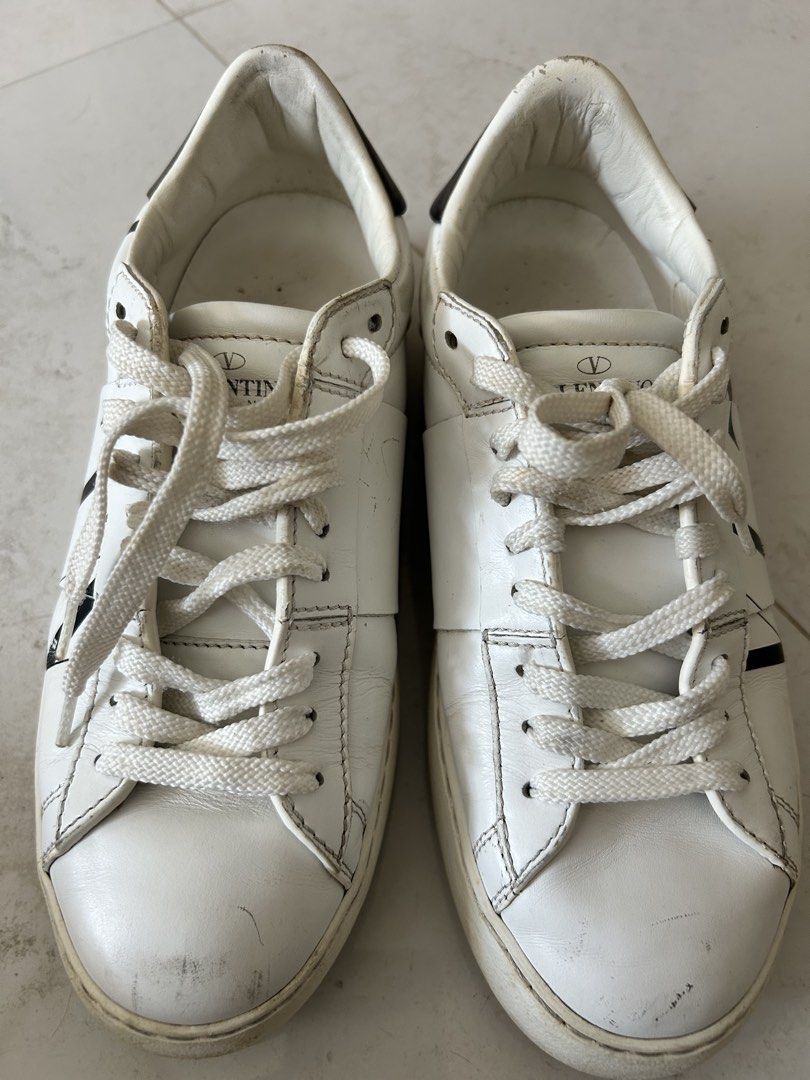 Valentino White Leather Rockstud Sneakers (Category: Sneakers) located in Cebu City. Submitted by carms123 (Listing ID 1440958943, Image 3). Description: - Authentic Valentino white leather sneakers - Black accent details - Iconic stud detailing along the sole - White laces - Size 36 - Shows minor signs of wear on heels and soles - Ideal for casual and everyday wear Bought maybe 6 years ago in Italy- have touched it in years .