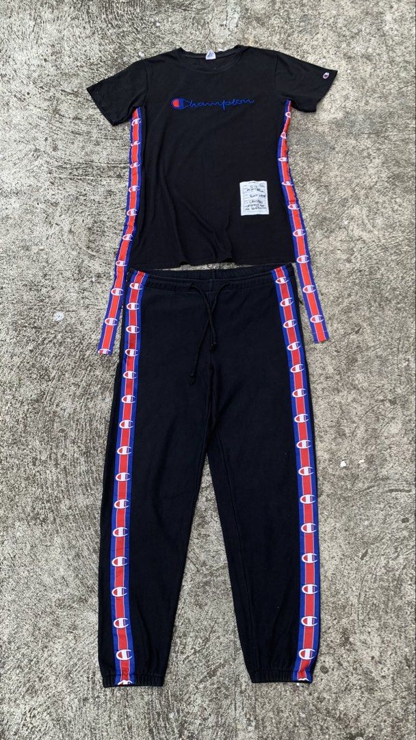 Vetements x Champion (Category: Sets & Coordinates) located in Jamindan. Submitted by darinville30528 (Listing ID 1441051291, Image 1). Description: - Dimes Tee Shirt: L31 x W22 - Dimes Pants: W34-36 x L39.5 - Dm📩 For More Details - Vetements x Champion black tracksuit set - Iconic Champion logo on t-shirt - Vetements Automne-Hiver 2018 print on back of t-shirt - Tape detailing down the sides of both top and bottoms - Ideal for casual wear or at