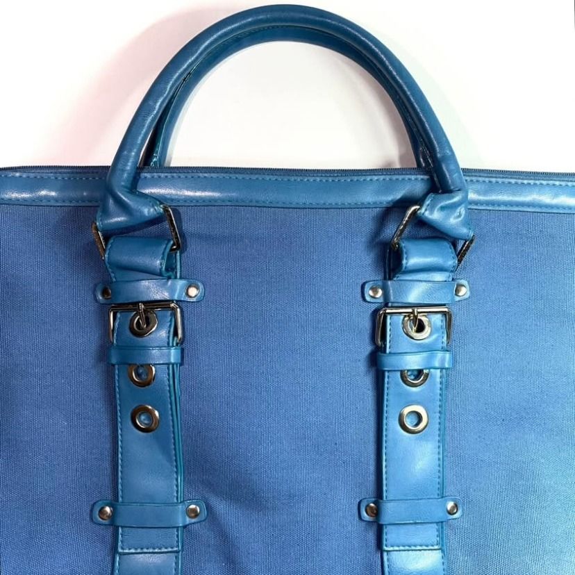 Vintage Blue Tote / Hand Bag (Category: Tote Bags) located in Las Pinas. Submitted by rewearstudios (Listing ID 1441137749, Image 2). Description: The bag’s exterior features vintage classic design with belt-like accent leather straps. Zip closure main compartment. One zip closure interior compartment. Very spacious and can fit your everyday essentials and more! Excellent condition. Pm me for more pics and details!.