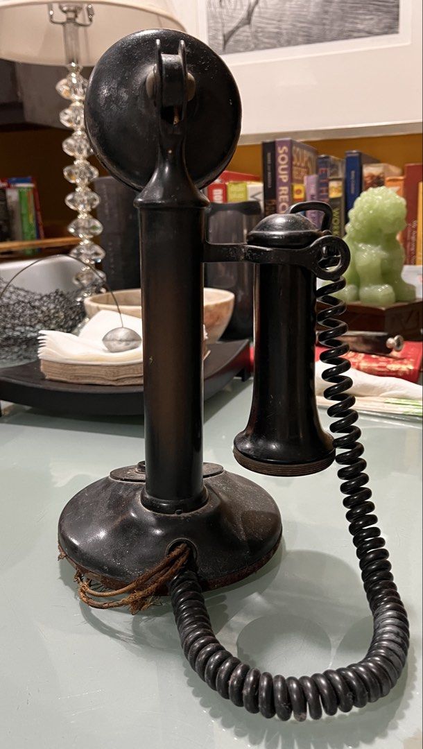 Vintage Candlestick Telephone (Category: Vintage Collectibles) located in Muntinlupa City. Submitted by projectnoclutter (Listing ID 1440982701, Image 2). Description: - Vintage Western Electric (?) candlestick telephone - Classic black design - Approximately 12 inches tall - Features a coiled cord - Ideal for collectors or as a unique decor piece - Adds a great retro vibe to any space.