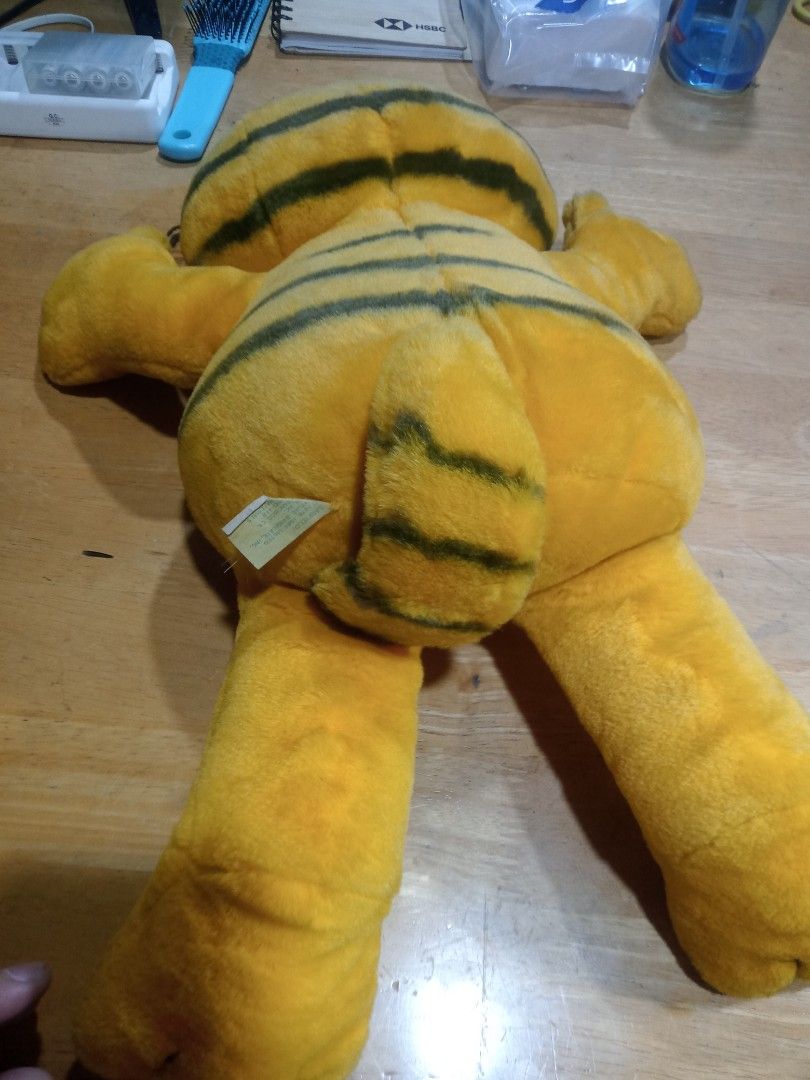 Vintage Garfield Plush Toy (Category: Plushies & Soft Toys) located in Makati City. Submitted by pardsroman (Listing ID 1441064720, Image 2). Description: - Classic Garfield plush toy - Orange and yellow with black stripes - Floppy arms and legs - Great for any Garfield fan - Shows some signs of wear due to age - Still has its original tag MOP via BPI or gcash payment first before delivery no return no exchange. shipping at buyers expense.