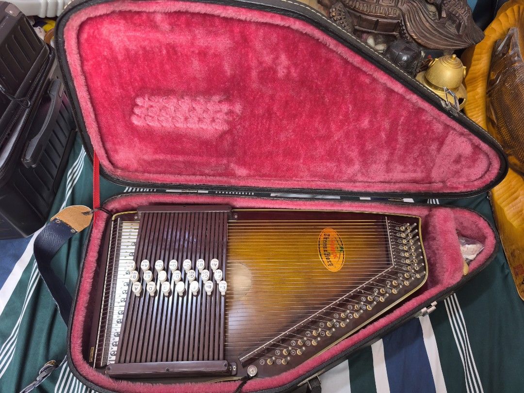 VINTAGE SAMICK CHROMAHARP 36 Strings 21 Chord's (Category: Musical Instruments) located in Davao. Submitted by rkkentmusi08036 (Listing ID 1440984641, Image 1). Description: Schmidt autoharp in its original case. The instrument has a beautiful sunburst finish. Includes all chord buttons and a strap. The case is black and lined with red velvet. Made in Korea. Great for learning or playing music..