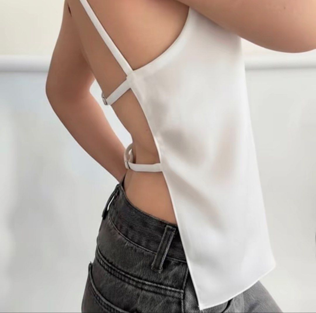 White Backless Top (Category: Sleeveless) located in Manila. Submitted by clairdeclutters (Listing ID 1441091969, Image 1). Description: - Unique backless design - Very nice, pretty, and sexy in person - Comfy fabric - Worn once and can fit up to large - Message me for more pics :) .