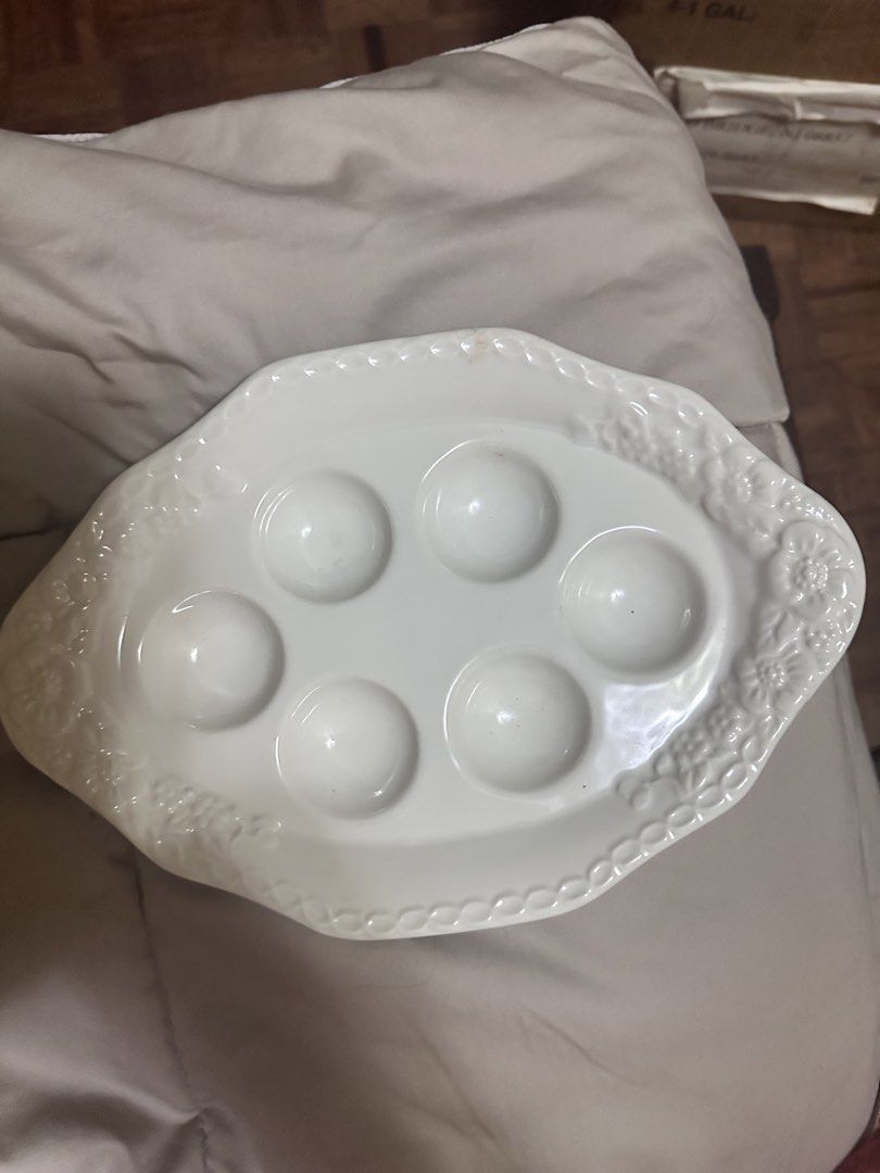 White Ceramic Escargot Plate with Embossed Floral Border (Category: Dinnerware & Cutlery) located in Quezon City. Submitted by mystictiger.019d9c (Listing ID 1441101626, Image 2). Description: - White ceramic plate for cooking or serving escargots - Features 6 indentations to hold shells securely - Elegant embossed floral and vine pattern on the border - Ideal for dinner parties and special occasions - Dishwasher safe for easy cleaning.