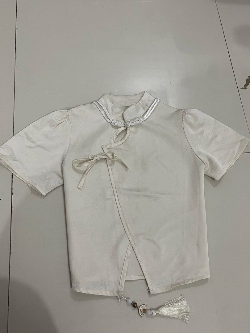 White Chinese Style Top with Knot Buttons (Category: Blouses) located in Trece Martires City. Submitted by rubyjwle (Listing ID 1441124326, Image 1). Description: - Classic white top - Traditional Chinese knot button closure -cropped Mop: payment first via gcash/maya Mod: direct jnt (buyer will shoulder sf) loc: cavite Open for meet up if malapit.