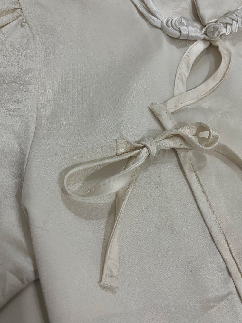 White Chinese Style Top with Knot Buttons (Category: Blouses) located in Trece Martires City. Submitted by rubyjwle (Listing ID 1441124326, Image 2). Description: - Classic white top - Traditional Chinese knot button closure -cropped Mop: payment first via gcash/maya Mod: direct jnt (buyer will shoulder sf) loc: cavite Open for meet up if malapit.