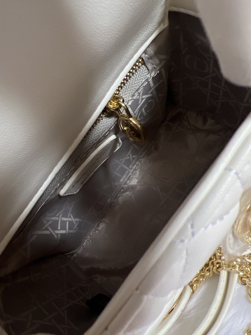 White Mini Bag (Category: Luxury Bags & Wallets) located in Pasay City. Submitted by imlilkittykat (Listing ID 1441003216, Image 2). Description: - White Dior Lady Dior Mini Bag from japan - Iconic Quilted Cannage Pattern - Elegant Gold Hardware - Includes Detachable Shoulder Strap - Interior Zippered Pocket - Clean Interior - Adorable Mini Size - Comes with Original Dust Bag - Ideal Size for Everyday Essentials DISCLAIMER: We are NOT affiliated,