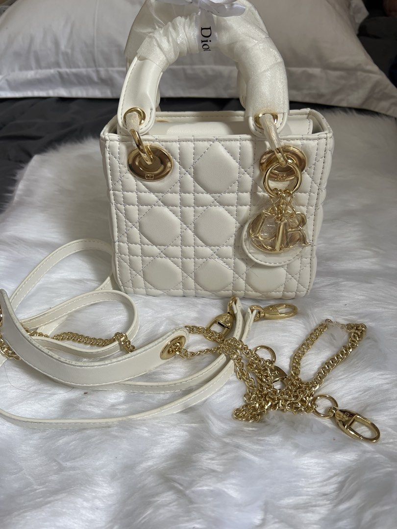White Mini Bag (Category: Luxury Bags & Wallets) located in Pasay City. Submitted by imlilkittykat (Listing ID 1441003216, Image 1). Description: - White Dior Lady Dior Mini Bag from japan - Iconic Quilted Cannage Pattern - Elegant Gold Hardware - Includes Detachable Shoulder Strap - Interior Zippered Pocket - Clean Interior - Adorable Mini Size - Comes with Original Dust Bag - Ideal Size for Everyday Essentials DISCLAIMER: We are NOT affiliated,