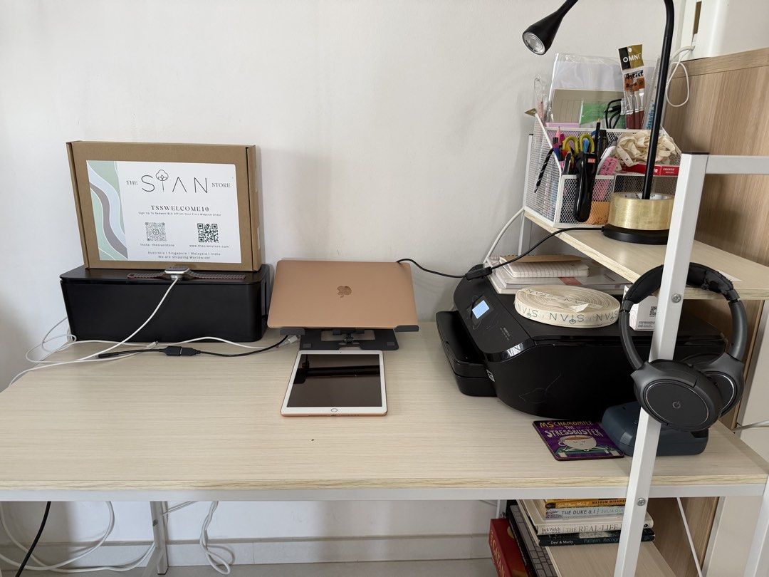 Study Table| Office table (Category: Tables & Sets) located in Singapore. Submitted by winter_mountains (Listing ID 1440975454, Image 2). Description: H-70cm L-120 W-60 Height of side shelves- 115cm - Complete desk setup for your home office or study. - Light wood desk with white metal legs. - Matching shelving unit. - Includes: Printer, laptop, tablet, books, headphones, office supplies. - All items neatly organized and ready to go..