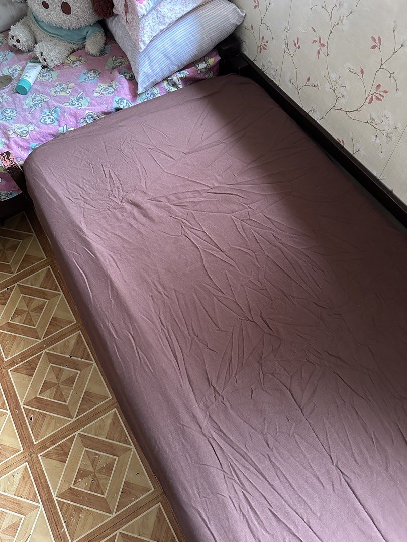Wooden Single Bed Frame with Uratex Mattress (Category: Bed Frames & Mattresses) located in Taguig. Submitted by pancea (Listing ID 1440995050, Image 2). Description: • selling as set • has signs of usage but well used • not for picky buyer • preferably within Metro Manila • DM me for any questions! Mattress: • W - 30 inches • L - 71 inches • H - 3.5 inches.