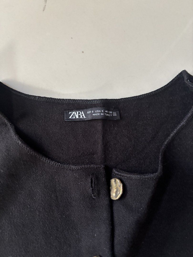 Zara Black Button-Up Sleeveless Vest (Category: Sleeveless) located in Manila. Submitted by starapple24_ (Listing ID 1441052728, Image 2). Description: only worn twice ! - Zara black vest - Size S (fits like S) - Gold-tone buttons down the front - Sleeveless design - Made in Turkey - Great for layering.