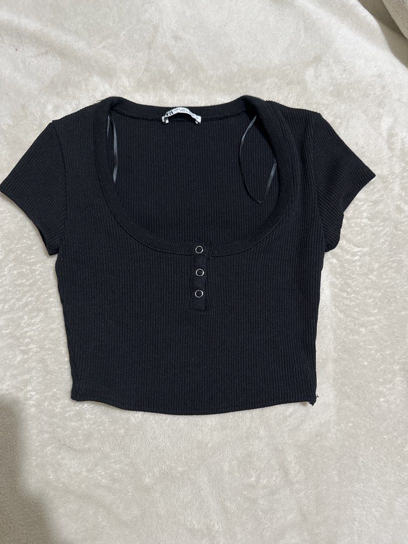 Zara Black Ribbed Cropped Top with Buttons (Category: Blouses) located in Mandaluyong City. Submitted by krstls (Listing ID 1441001718, Image 1). Description: - Zara ribbed cropped top - Scoop neckline with 3 front buttons - Short sleeves - Made in Turkey - Versatile: pairs well with high-waisted jeans or skirts.