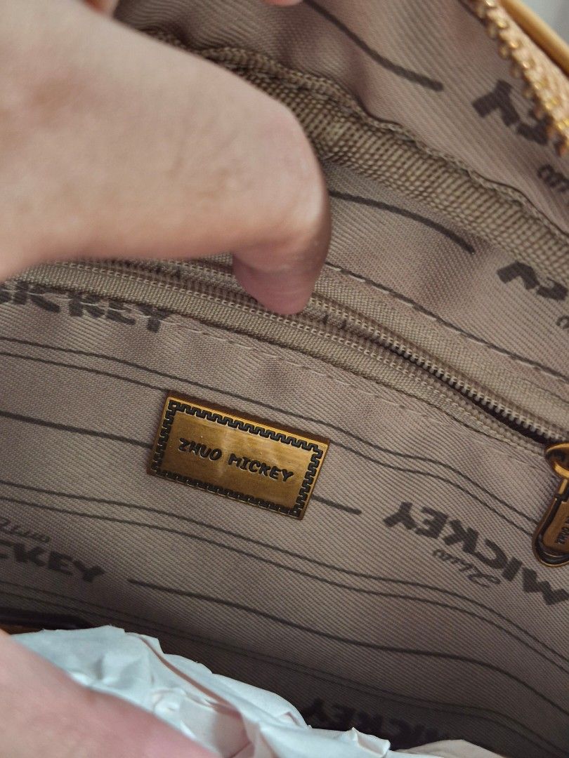 Zhuo MICKEY Brown Monogram Satchel Bag (Category: Luxury Bags & Wallets) located in Davao. Submitted by wangcollections (Listing ID 1441064828, Image 2). Description: - Size: Semi medium - Brand new never used - Brown satchel bag.