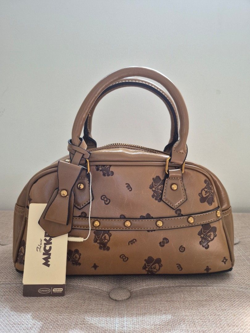 Zhuo MICKEY Brown Monogram Satchel Bag (Category: Luxury Bags & Wallets) located in Davao. Submitted by wangcollections (Listing ID 1441064828, Image 1). Description: - Size: Semi medium - Brand new never used - Brown satchel bag.