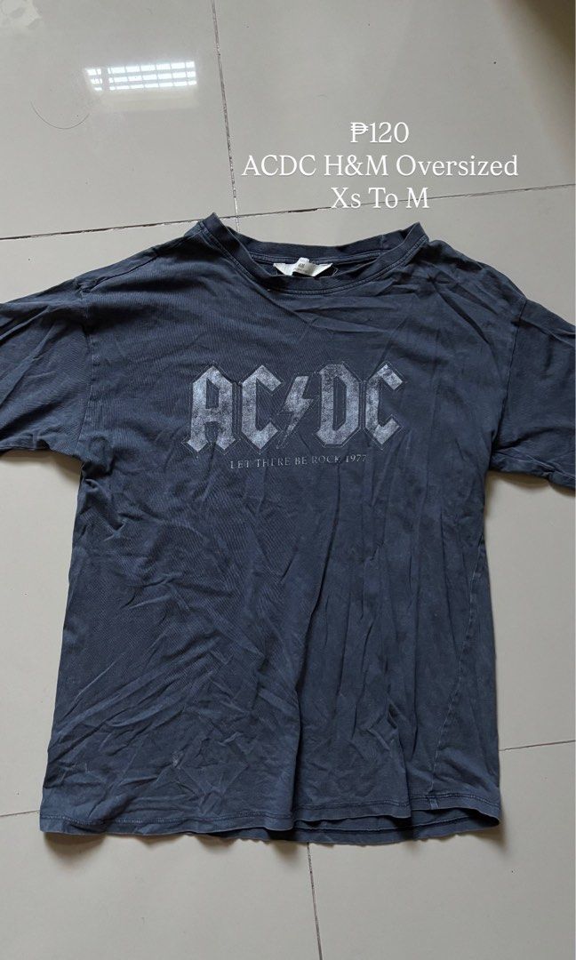 ACDC H&M Oversized T-shirt (Category: Tshirts & Polo Shirts ) located in Manila. Submitted by yanihatesu (Listing ID 1435981515, Image 1). Description: Oversized ACDC t-shirt from H&M. It features the ACDC logo with the text "LET THERE BE ROCK 1977". The shirt is a dark grey color. It is available in sizes from XS to M..