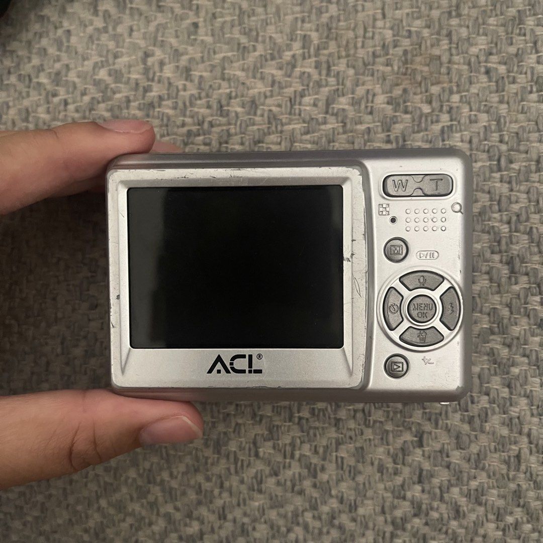 ACL-DC500 Digital Camera (Category: Cameras) located in Valenzuela. Submitted by snoopstuff (Listing ID 1435935453, Image 2). Description: Selling digicam japan unit FULLY functional - 5x digital zoom - 2.4" LCD screen - Movie clip function - Silver color - Uses AA batteries - Includes frame options - has GAMES!! - can be used without SD card (quantity will depend on the quality of photos u want) - Only issue is matagal onti mag snap if hindi wit