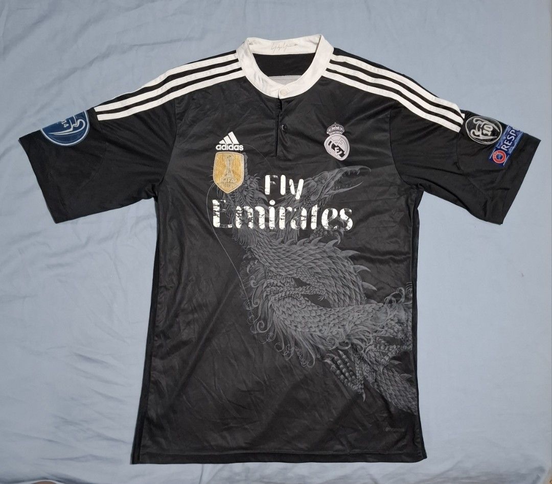 Adidas Real Madrid Dragon Football Jersey Vintage Wornout Rustic Style (Category: Activewear) located in Singapore. Submitted by jms1233 (Listing ID 1436024553, Image 1). Description: -Condition is already stated, quite well used Real Madrid Football Jersey, not for fussy buyers especially at the low price -Measurements: chest across (p2p)= 42-45cm top of collar to end of shirt= ~75cm -Has a nice wornout look, good for casual style/ normal wear -