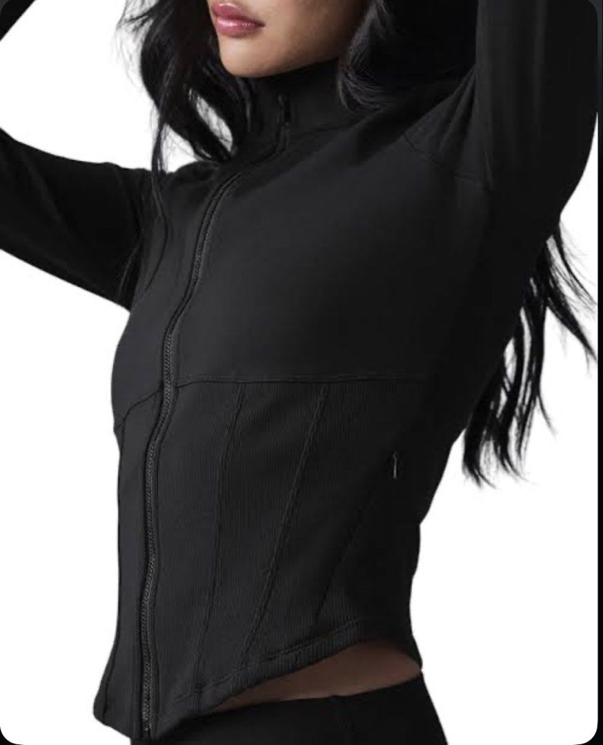 Alo Yoga Corset Zip-Up Jacket (Category: Activewear) located in Quezon City. Submitted by apujooz (Listing ID 1435957184, Image 1). Description: Authentic Brand New Black zip-up jacket from Alo Yoga. Features a high collar and a ribbed panel across the midsection. The jacket has a full-length zipper and long sleeves. The Alo logo is visible on the back and on the tag. Size is XS/TP/ECH..