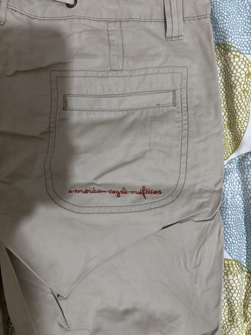American Eagle Outfitters Khaki low waisted Pants (Category: Jeans) located in Manila. Submitted by loopy99999 (Listing ID 1436053236, Image 3). Description: (HOOK FELL OFF) but can still be worn from the drawstring - American Eagle Outfitters khaki pants - Size: 6 - Features a single back pocket with red embroidered logo - Material: 100% cotton - Made in Hong Kong - Style: Classic casual.