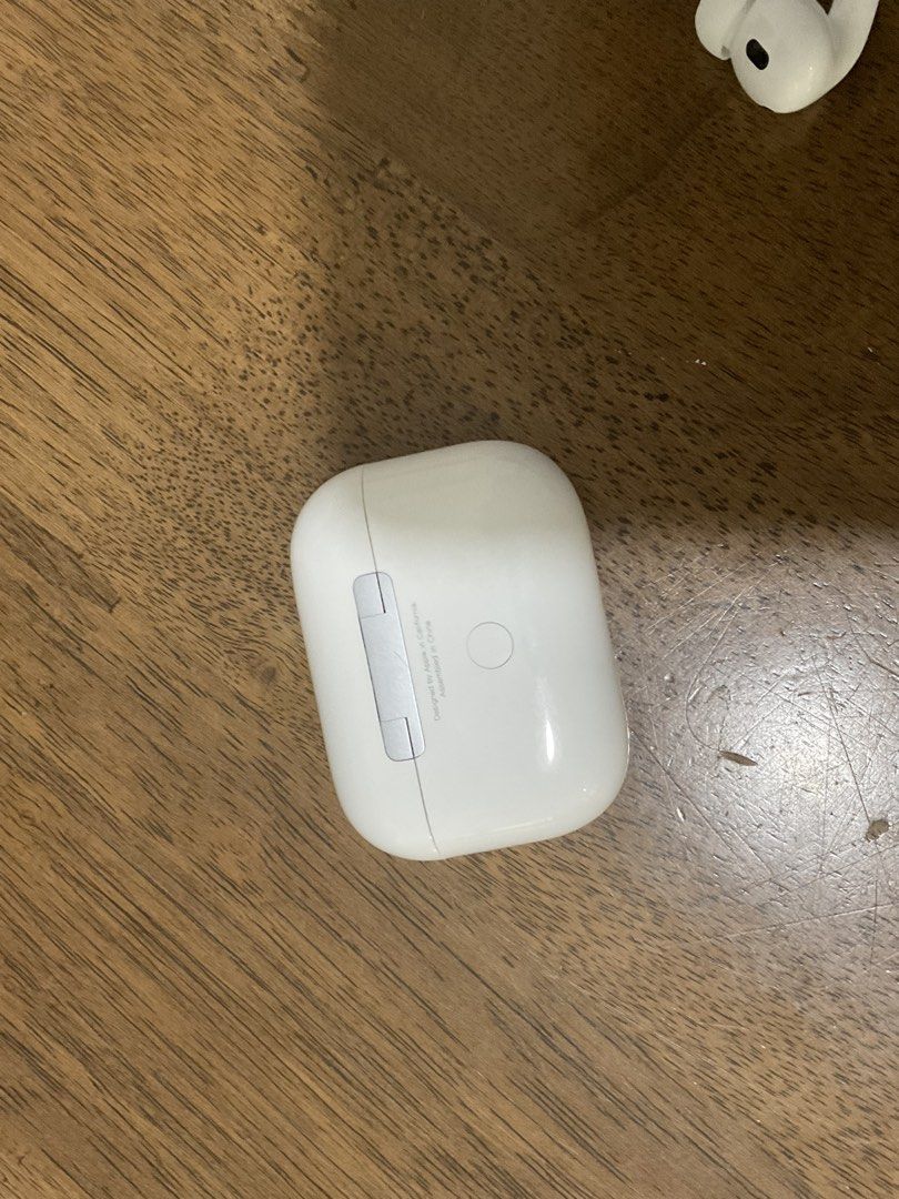 Apple AirPods Pro 2 (Category: Earphones) located in Manila. Submitted by takemystuffbuymystuff (Listing ID 1435963196, Image 2). Description: - Apple AirPods Pro - Includes charging case and both earbuds - White color - Charging case with indicator light - Model number visible on case bottom.