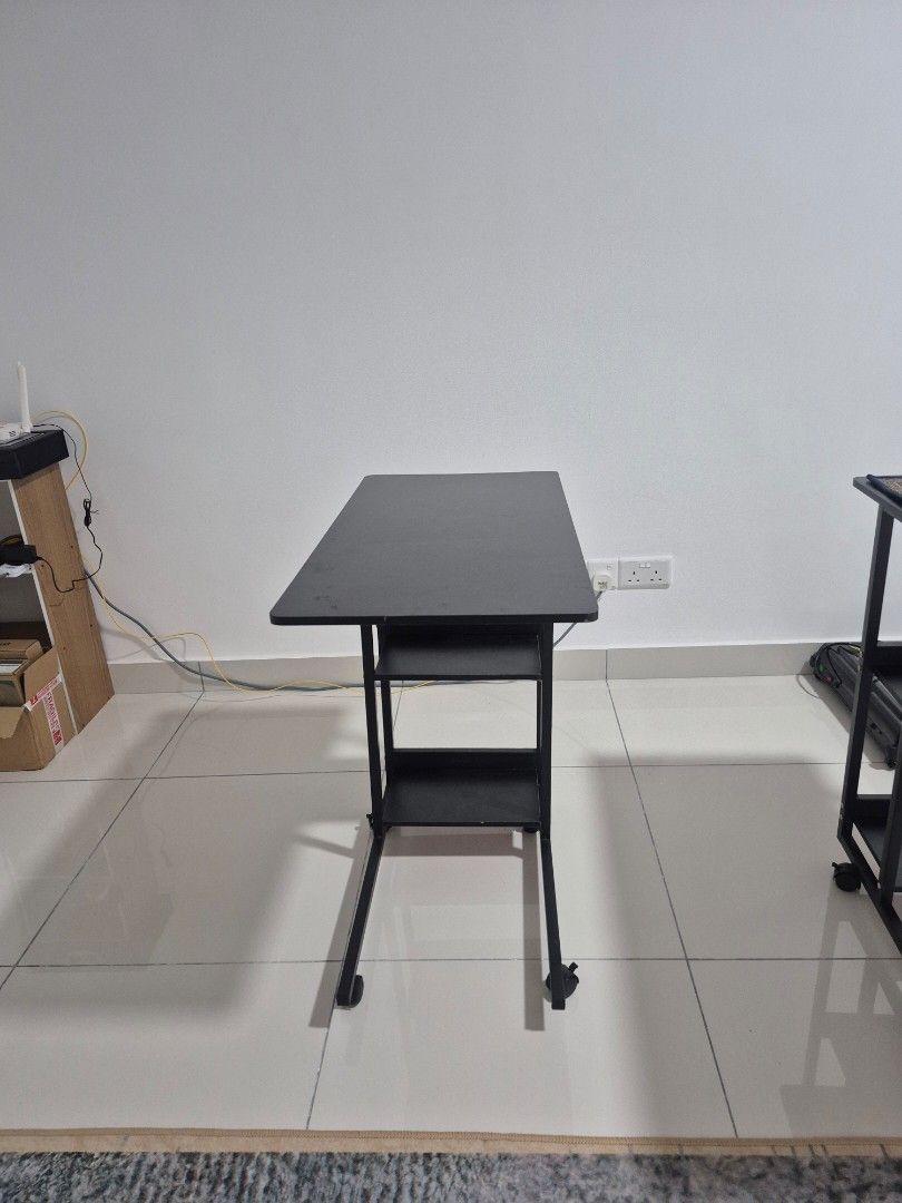 Bedside Table Side Table (Category: Other Home Furniture) located in Kuala Lumpur. Submitted by aily17 (Listing ID 1435976508, Image 3). Description: Details and dimension in 5th picture. I bought this for about RM55. One of the back wheel is broken, doesn't stay up properly. The wheels can still be used, just that the table will wobble. If you set the table to be stationary (not moving), you can adjust the broken wheel back to its place and it w