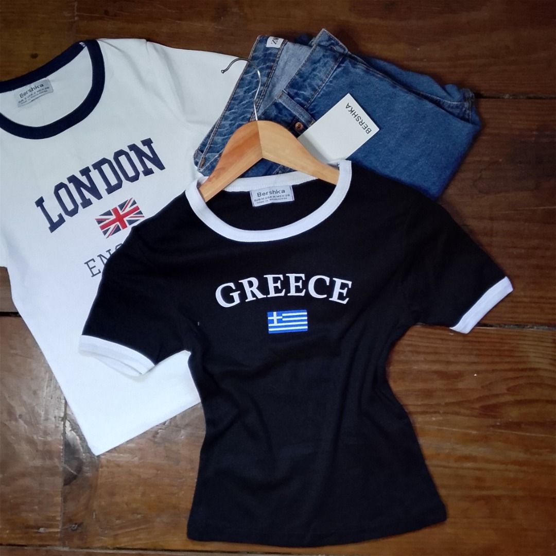 Bershka Graphic T-shirts (Category: Shirts) located in Baguio. Submitted by kezsells (Listing ID 1436009552, Image 3). Description: - Bershka graphic t-shirts - Featuring country designs: London, Spain, Scotland, Argentina, Greece, USA - Contrasting collar and sleeve colors - Made of soft, comfortable material - Perfect for casual wear.