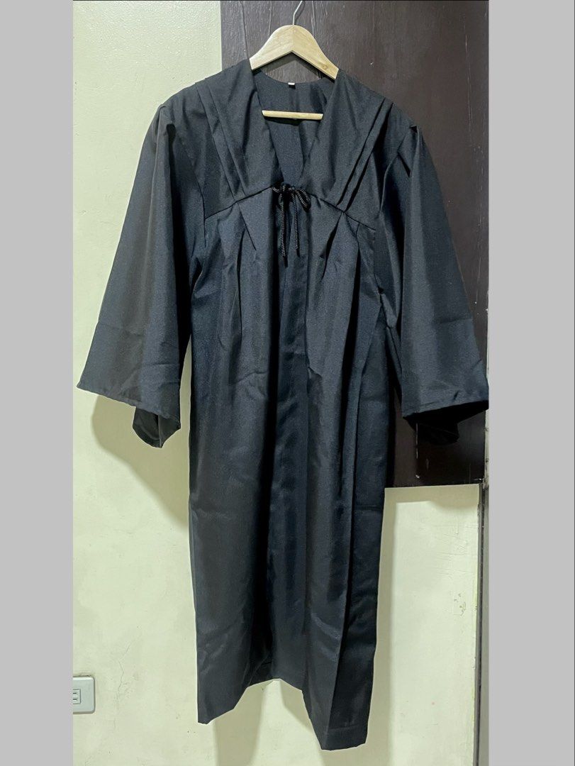 Black Graduation Gown (Toga) (Category: Evening dresses & gowns) located in Manila. Submitted by hello.kiwi (Listing ID 1436085505, Image 1). Description: - Selling low - Used once for oath taking - V-neckline; tie detail - Wide sleeves; knee-length hem - Smooth fabric - Fits Medium to Large - Original price: Php 699 - Location: Manila.