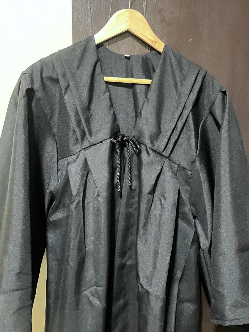 Black Graduation Gown (Toga) (Category: Evening dresses & gowns) located in Manila. Submitted by hello.kiwi (Listing ID 1436085505, Image 2). Description: - Selling low - Used once for oath taking - V-neckline; tie detail - Wide sleeves; knee-length hem - Smooth fabric - Fits Medium to Large - Original price: Php 699 - Location: Manila.