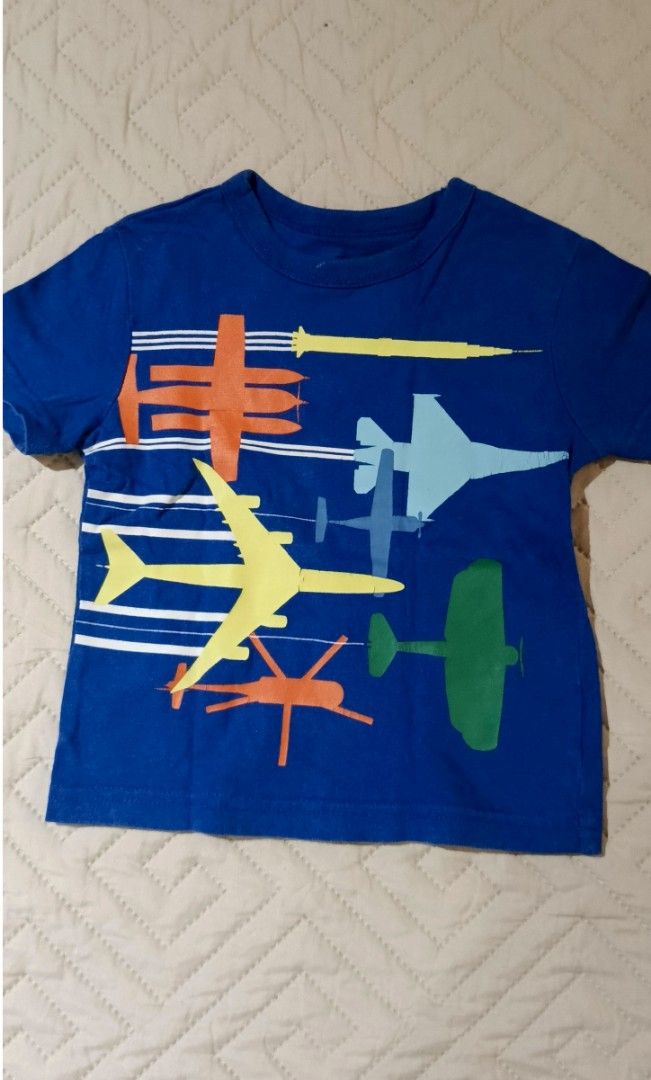 Blue Airplane Print T-shirt (Category: Babies & Kids Fashion) located in Antipolo. Submitted by sylvannah17 (Listing ID 1435946849, Image 1). Description: - Blue t-shirt - Features a vibrant airplane graphic - Crew neck design - Short sleeves - Made from soft, comfortable fabric - Ideal for casual everyday wear.