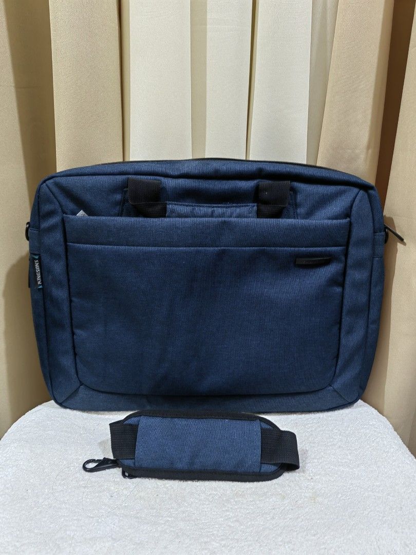 Blue Laptop Bag with Shoulder Strap (Category: Laptop Bags & Sleeves) located in Makati City. Submitted by prelovedtreatedwithlove (Listing ID 1436095854, Image 2). Description: - Blue laptop bag - Detachable shoulder strap - Top handle - Front pocket - Zippered main compartment - Durable fabric - Dimensions: Approximately 12" (H) x 16" (W) No issue.