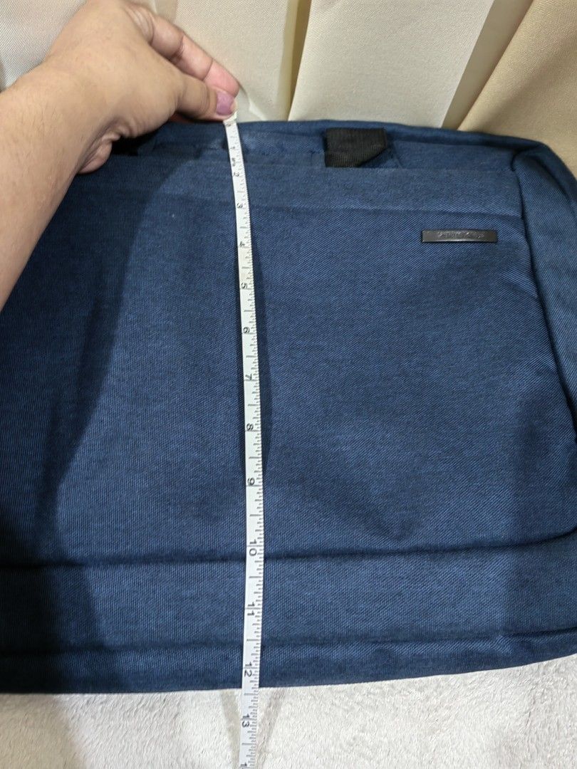 Blue Laptop Bag with Shoulder Strap (Category: Laptop Bags & Sleeves) located in Makati City. Submitted by prelovedtreatedwithlove (Listing ID 1436095854, Image 3). Description: - Blue laptop bag - Detachable shoulder strap - Top handle - Front pocket - Zippered main compartment - Durable fabric - Dimensions: Approximately 12" (H) x 16" (W) No issue.