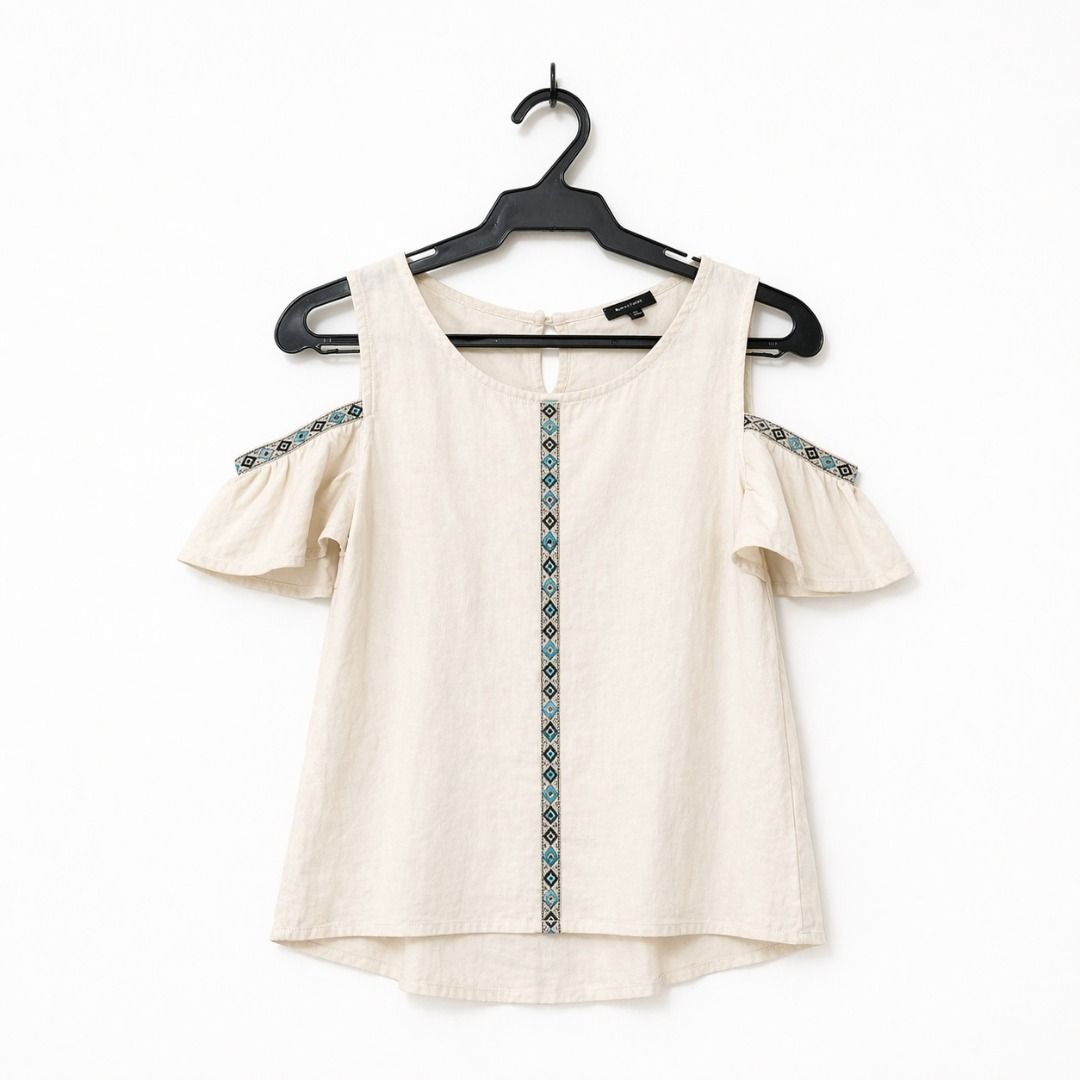 Boho Cold-Shoulder Top w/ Tribal Embroidery (Category: Blouses) located in Caloocan City. Submitted by clevergem.3a2a2d (Listing ID 1436016877, Image 1). Description: - Cream-colored off-shoulder top - Round neckline - Embroidered details on front and shoulder cutouts - Ruffled sleeves.