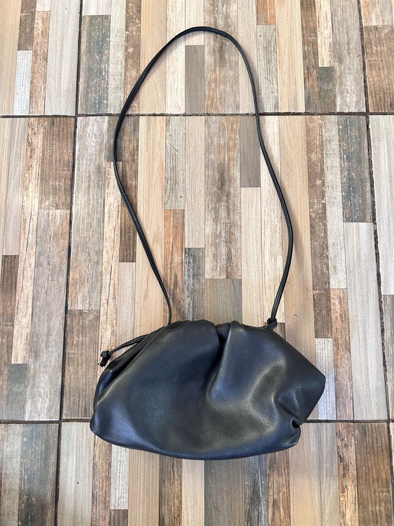 Bottega Veneta Black Shoulder Bag (Category: Luxury Bags & Wallets) located in Tarlac. Submitted by ae01019x (Listing ID 1435975647, Image 1). Description: - Black Bottega Veneta shoulder bag - Gathered design - Long strap - Interior label: "Made in Italy" - Serial number: B06353555N no issues color may vary due to lighting condition.