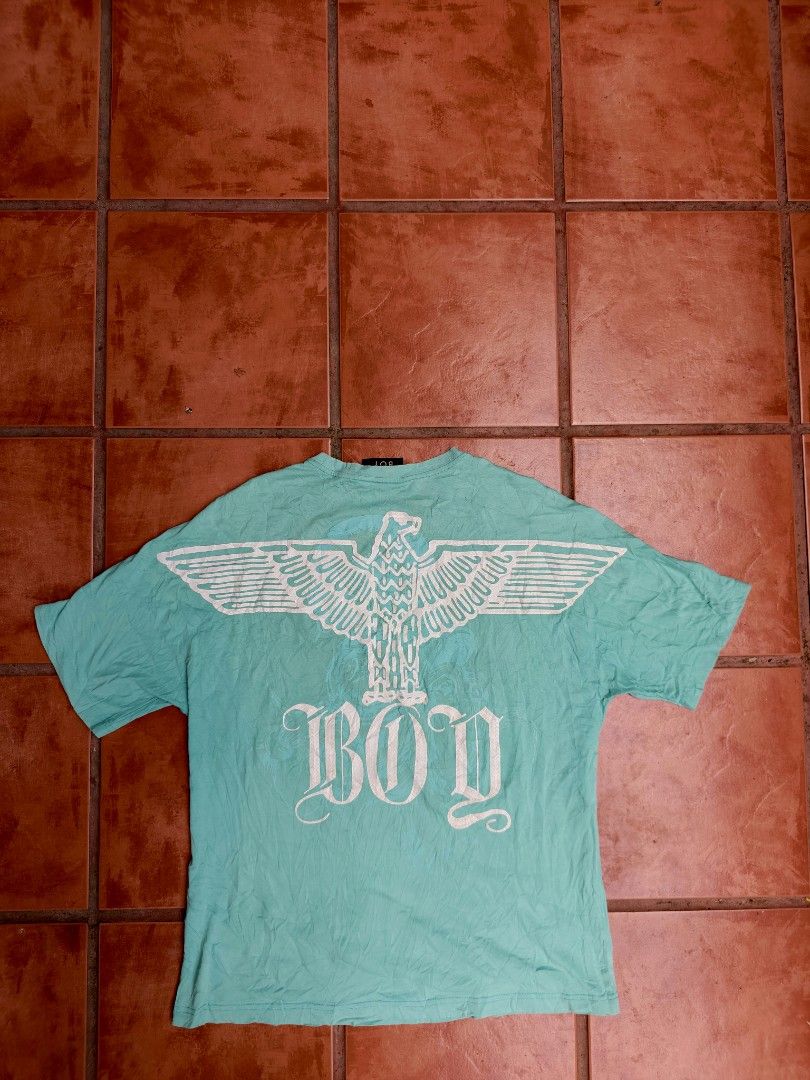 Boy London Eagle Graphic T-shirt (Category: Tshirts & Polo Shirts ) located in Manila. Submitted by lesterpogs30 (Listing ID 1436074869, Image 2). Description: - Authentic Boy London T-shirt - Size: M - Color: Light Teal - Features an eagle graphic on the back - Boy London logo on the front - Crew neck and short sleeves.