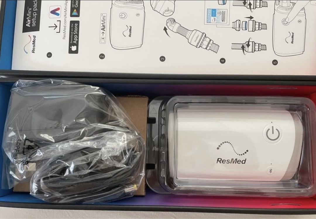 BRAND NEW ResMed AirMini CPAP Machine (Category: Medical Supplies & Tools) located in Manila. Submitted by musthaveph___ (Listing ID 1435979577, Image 2). Description: - ResMed AirMini portable CPAP machine - Includes AirMini setup pack - Comes with power supply and tubing - Features a power button - Bluetooth indicator for easy connection - Box clearly displays the ResMed logo and AirMini model name - Setup pack includes tube and other accessori