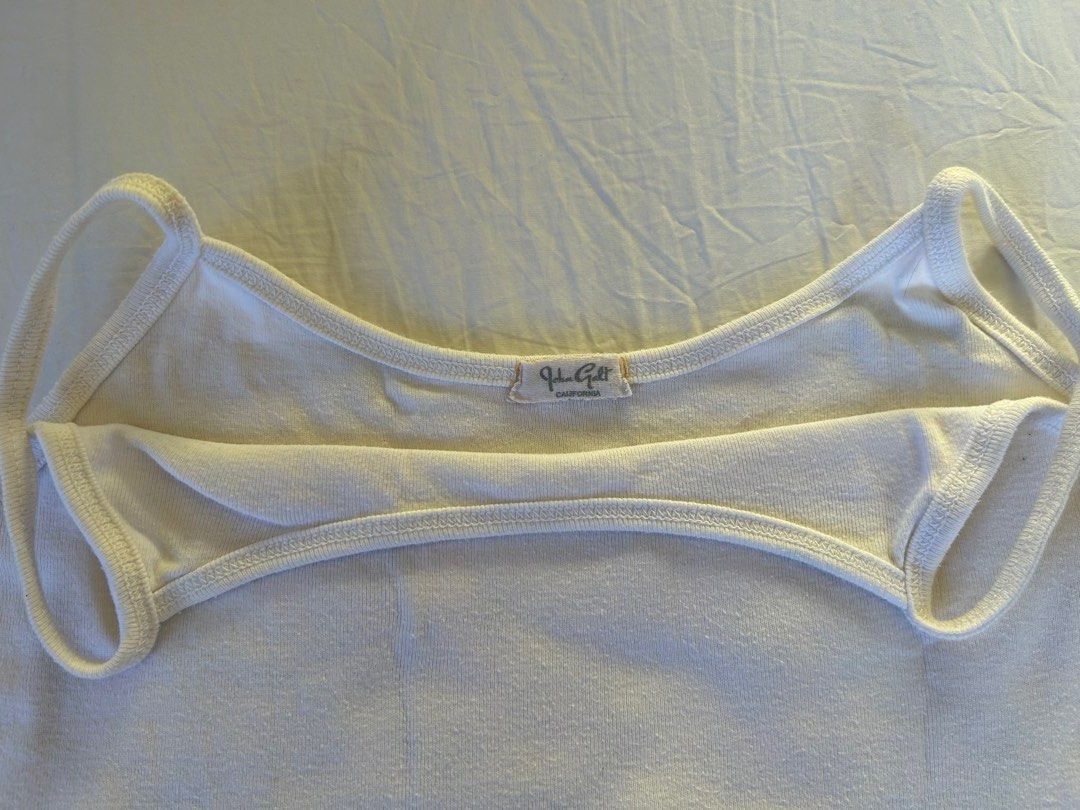 Brandy Melville White Cropped Tank Top (Category: Sleeveless) located in Makati City. Submitted by swedishcandy (Listing ID 1436096866, Image 3). Description: - Brand: Brandy Melville - Style: Tank top - Color: White - Scoop neck, spaghetti straps, ribbed knit fabric, curved hem - Perfect basic for layering or wearing on its own..