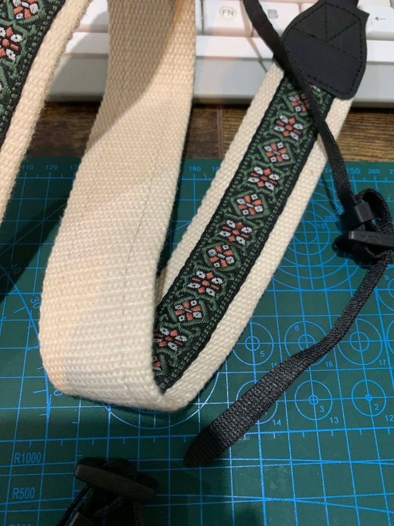 ⭐SALE Camera Strap with Floral Design (Category: Camera Bags & Carriers) located in Bacolod City. Submitted by kyaramatcha (Listing ID 1436018732, Image 2). Description: Stylish camera strap with a cream base, floral pattern, and black leather ends. Durable canvas material. Adjustable for a secure fit. RFS: bought but never used.