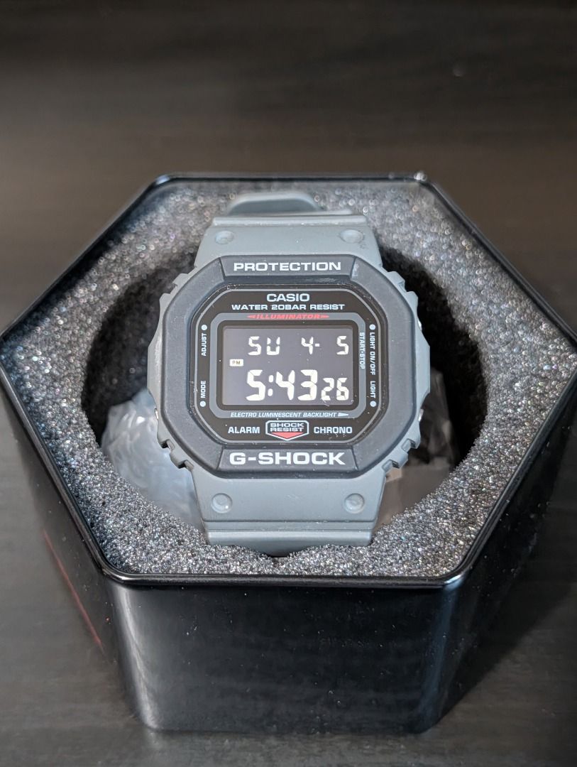 Casio G-Shock DW-5610SU-8DR Watch (Category: Men's Watches) located in Mandaluyong City. Submitted by hasegawa14 (Listing ID 1435988750, Image 2). Description: - Casio G-Shock DW-5610SU-8DR - Gray resin band and case - Digital display (time, date, day) - Water resistant to 200 meters - Shock resistant - Includes original box, manual, and tag.