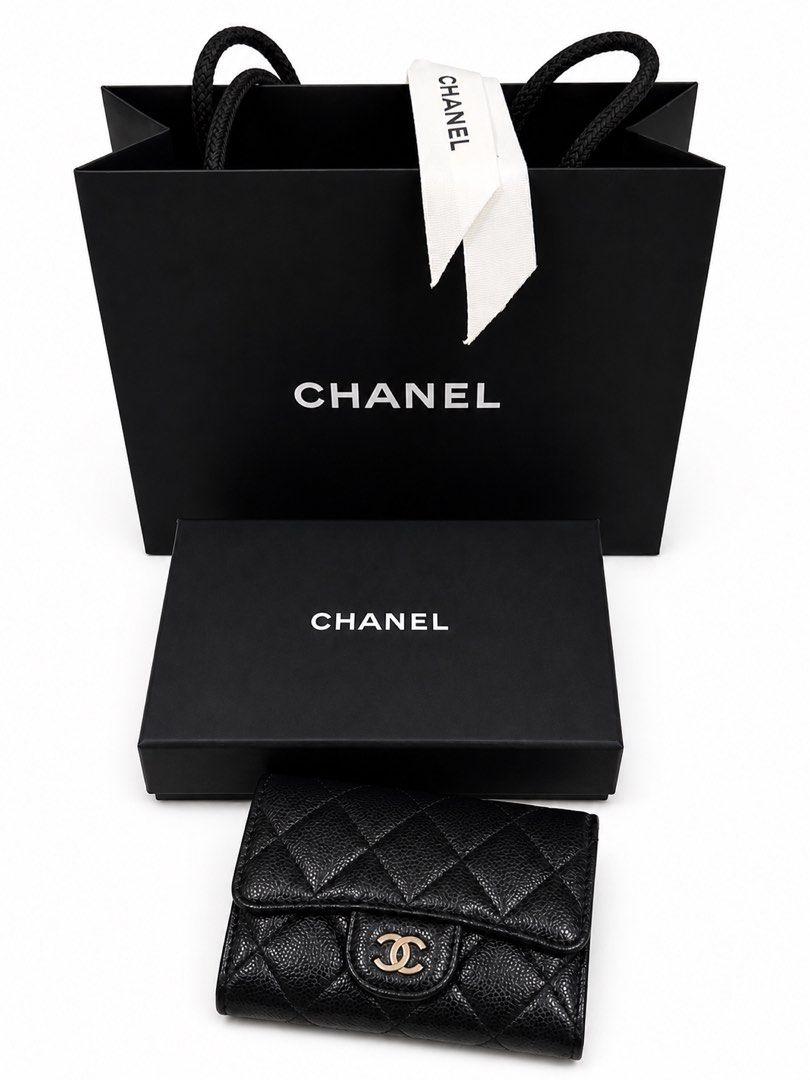 Chanel Quilted Wallet (Category: Luxury Bags & Wallets) located in Manila. Submitted by neferttipe04482 (Listing ID 1436021736, Image 1). Description: Flap Card Holder in Black Caviar Leather and Gold Hardware - Authentic Chanel wallet - Quilted design with CC logo - Black color - Includes original box and dustbag - Includes shopping bag - Includes ribbon.