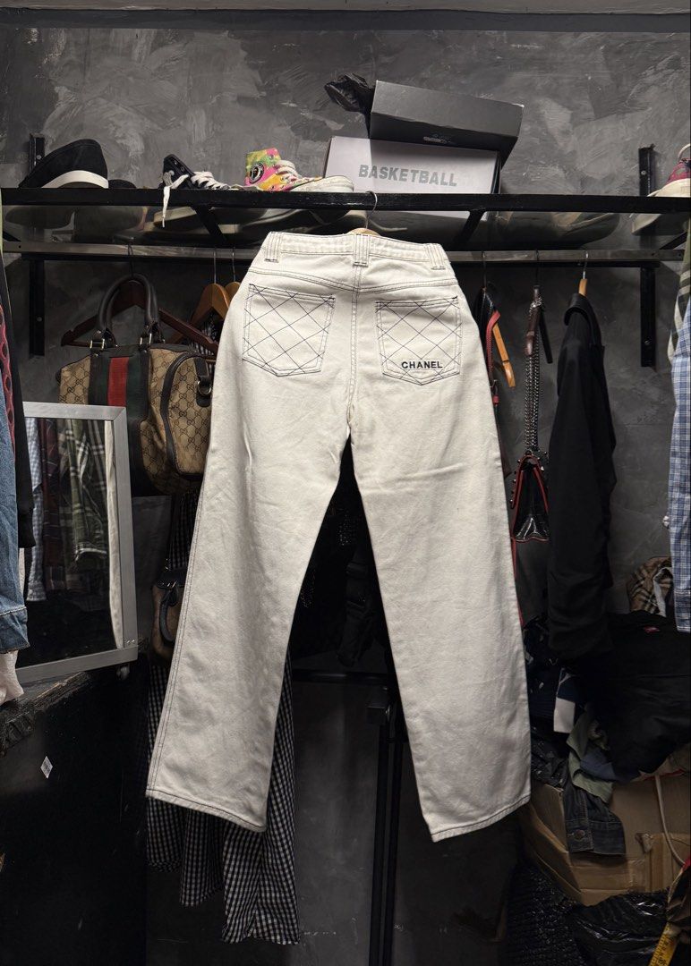 Chanel Wide Leg Denim Pants (Category: Jeans) located in Legazpi City. Submitted by deadthrift (Listing ID 1436043557, Image 2). Description: - Chanel white denim pants - Black stitching detail - Chanel logo on back pocket and button - Size: 26-27 (Tag size 36).