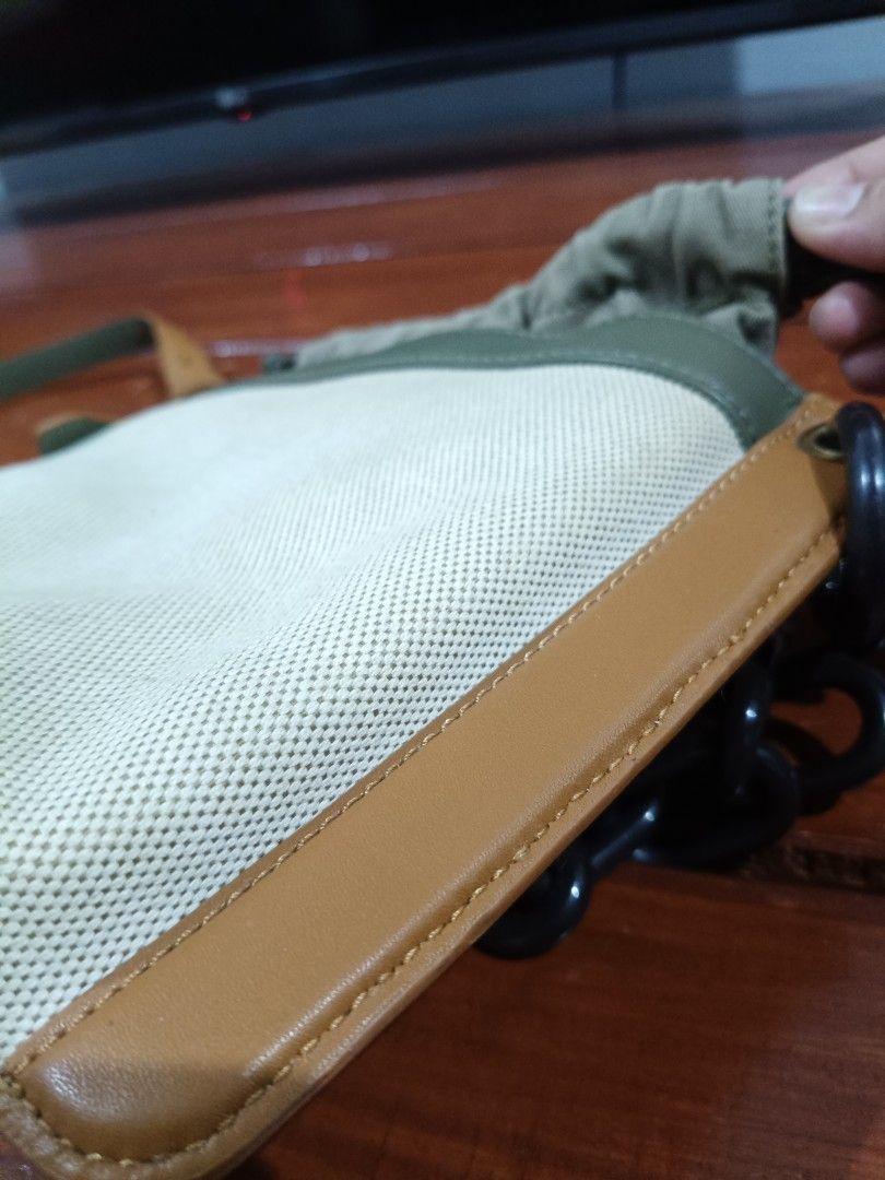 Charles & Keith Bucket Bag with Chain (Category: Luxury Bags & Wallets) located in Dagupan City. Submitted by sumiko091 (Listing ID 1435992766, Image 2). Description: - Charles & Keith bucket bag - Neutral canvas body - Brown leather accents - Black chain strap - Drawstring closure - Green interior - Includes long strap for shoulder/crossbody wear - Perfect for everyday use.