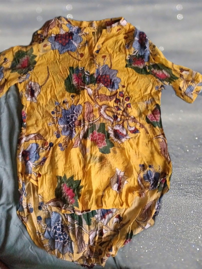 YIKIN (Chic Mustard Floral Tunic) (Category: Blouses) located in Manila. Submitted by hershop.sbt (Listing ID 1435944354, Image 1). Description: Design: Vibrant yellow base with intricate, colorful floral patterns. Fit: Relaxed, airy cut with short sleeves and a stylish high-low hem—ideal for layering or wearing as a statement top. Style: Perfect for beach trips, festivals, or casual coffee dates. Condition: Excellent, pre-loved condition, ready 