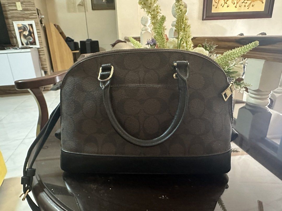 Coach mini sierra (Category: Luxury Bags & Wallets) located in Manila. Submitted by kkkkndll (Listing ID 1435920544, Image 3). Description: - Authentic Coach handbag - Dome shape with signature brown print and black base - Top handle and detachable shoulder strap - Includes Coach hangtag - Gold-tone hardware - Dark fabric interior lining - Protective metal feet at the bottom - medyo faded na ung print sa loob na coach .