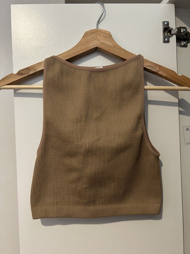 Cotton On Ribbed Tank Top XS (Category: Sleeveless) located in Manila. Submitted by lex_declutters (Listing ID 1435955556, Image 1). Description: - Cotton On ribbed tank top - Neutral brown color - Square neckline - Fitted silhouette - Size: XS/PP/S - Made in Vietnam - Versatile for layering or wearing alone.