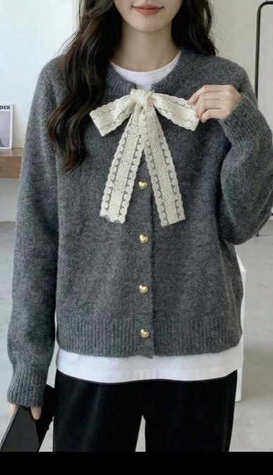 Dark Gray Bow Cardigan (Category: Coats, Jackets and Outerwear) located in Binan City. Submitted by anncharleneann (Listing ID 1436069545, Image 1). Description: - Dark gray cardigan - Delicate bow detail - Heart-shaped buttons - Round neckline - Long sleeves - Soft, textured material - Versatile for various outfits.