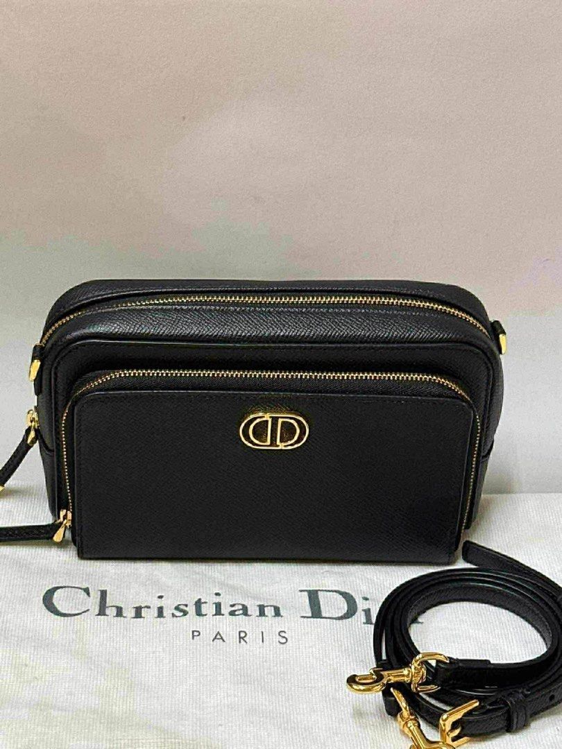 Dior Black Crossbody Bag (Category: Luxury Bags & Wallets) located in Manila. Submitted by personalprelovedmnl (Listing ID 1435972557, Image 1). Description: - Authentic Dior crossbody bag - Black leather exterior - Gold-tone CD logo - Detachable strap - Multiple compartments with gold zippers - Includes dust bag.